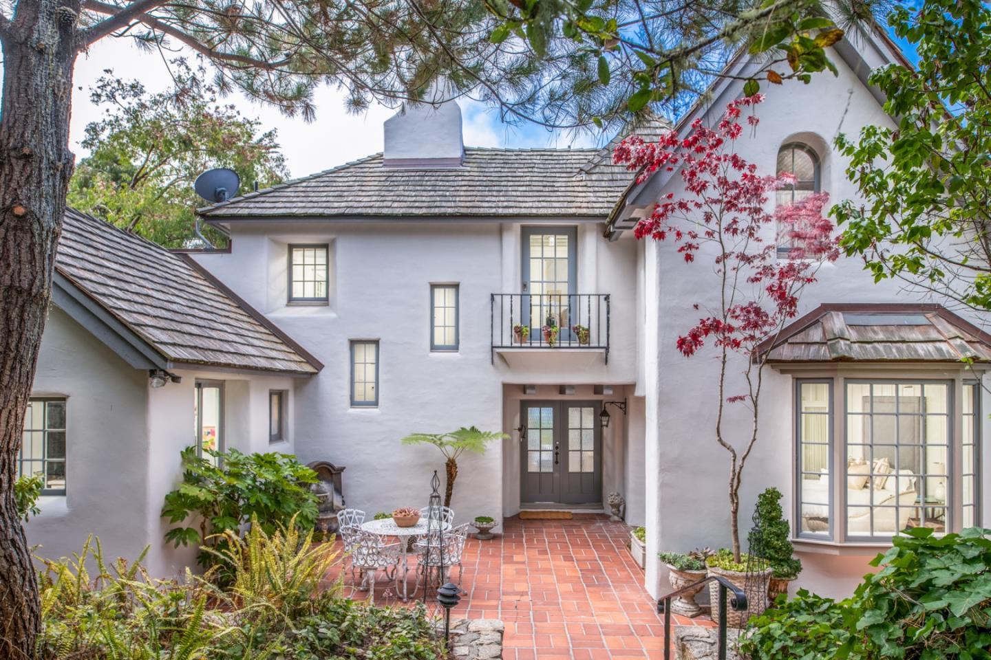 a front view of a house with garden