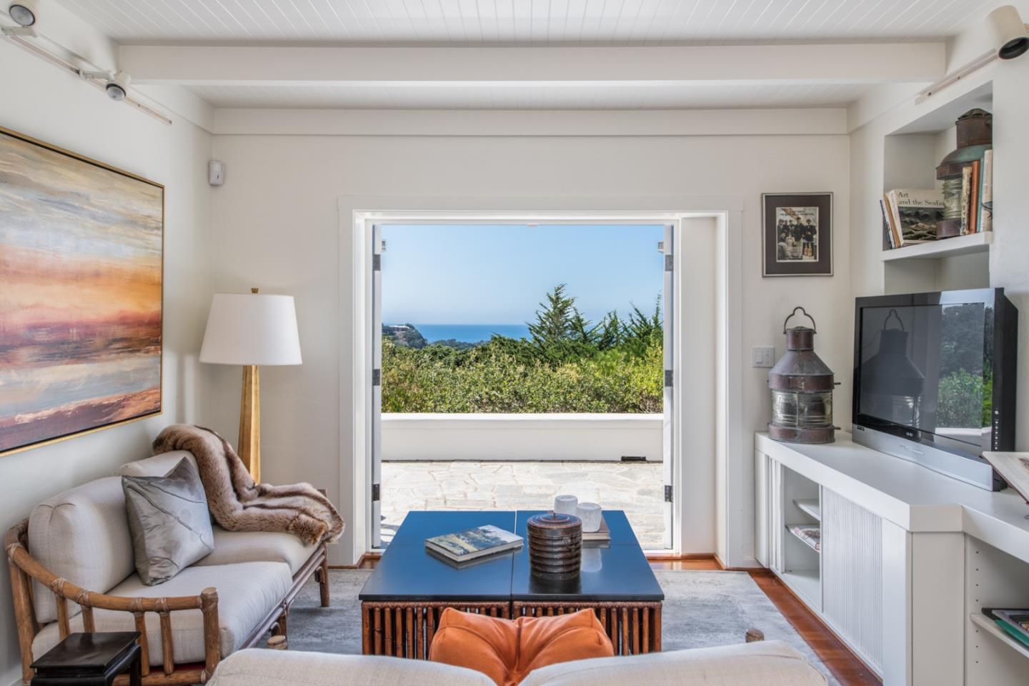 112 Pine Way Carmel Highlands, CA 93923 - Photo 15 of 33 a living room with furniture and a flat screen tv