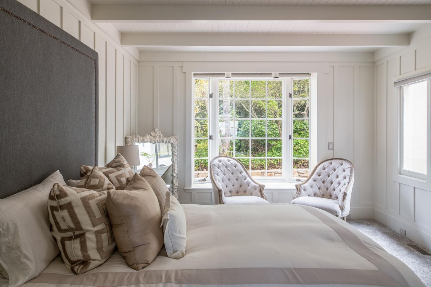 112 Pine Way Carmel Highlands, CA 93923 - Photo 16 of 33 a bed sitting in a bedroom next to a window