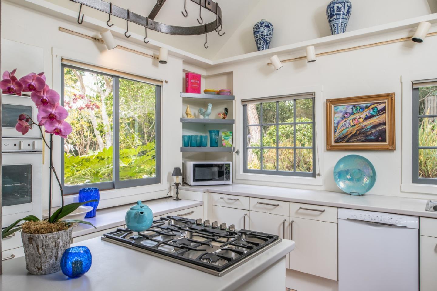 112 Pine Way Carmel Highlands, CA 93923 - Photo 21 of 33 a kitchen with a stove a sink and a window