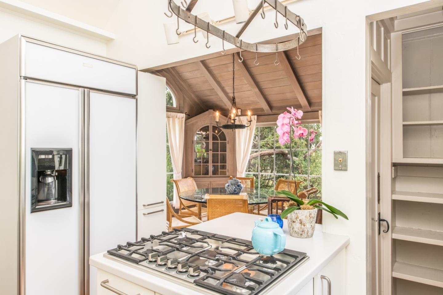 112 Pine Way Carmel Highlands, CA 93923 - Photo 22 of 33 a kitchen with a refrigerator and a stove