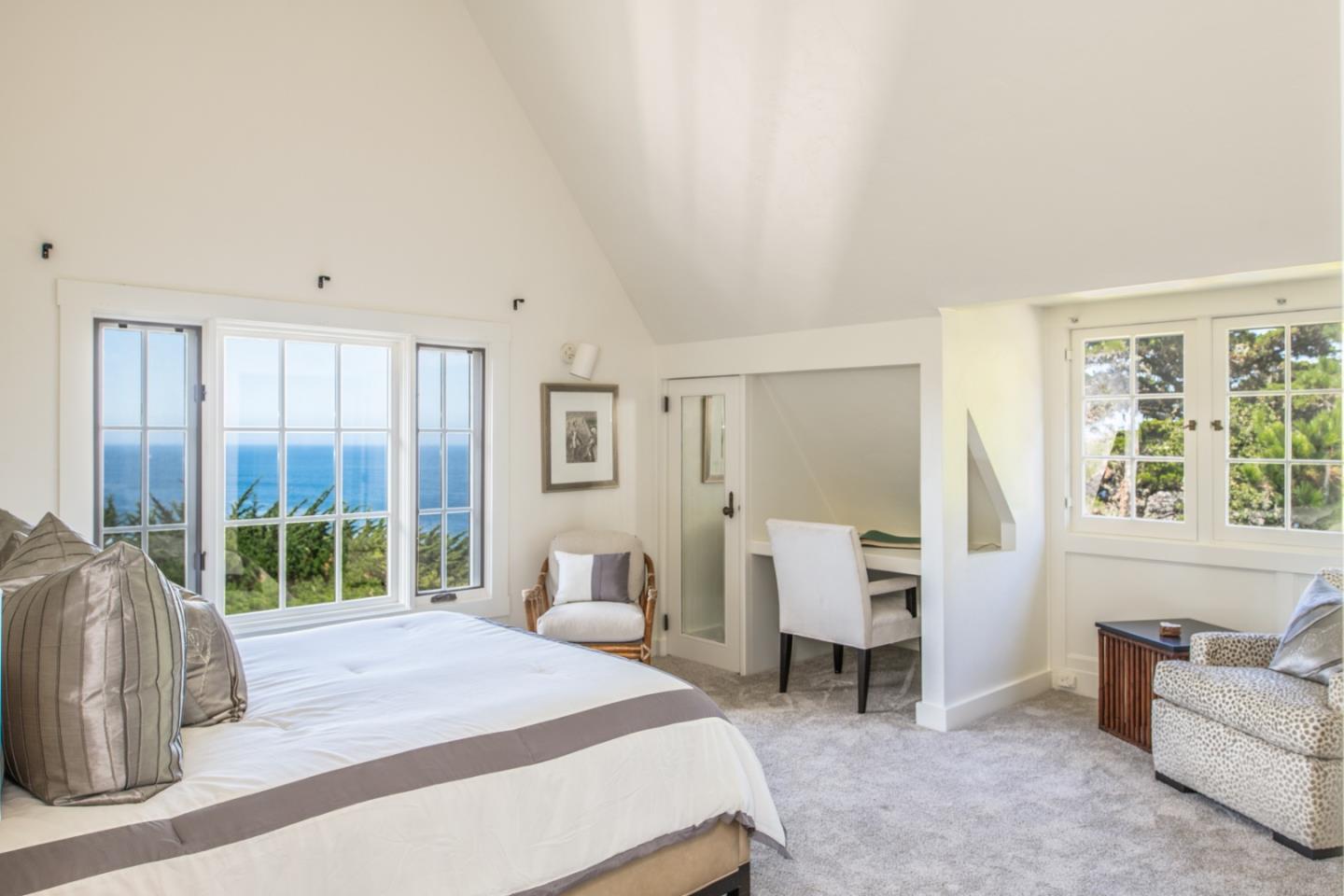 112 Pine Way Carmel Highlands, CA 93923 - Photo 25 of 33 a bedroom with a bed and a large window