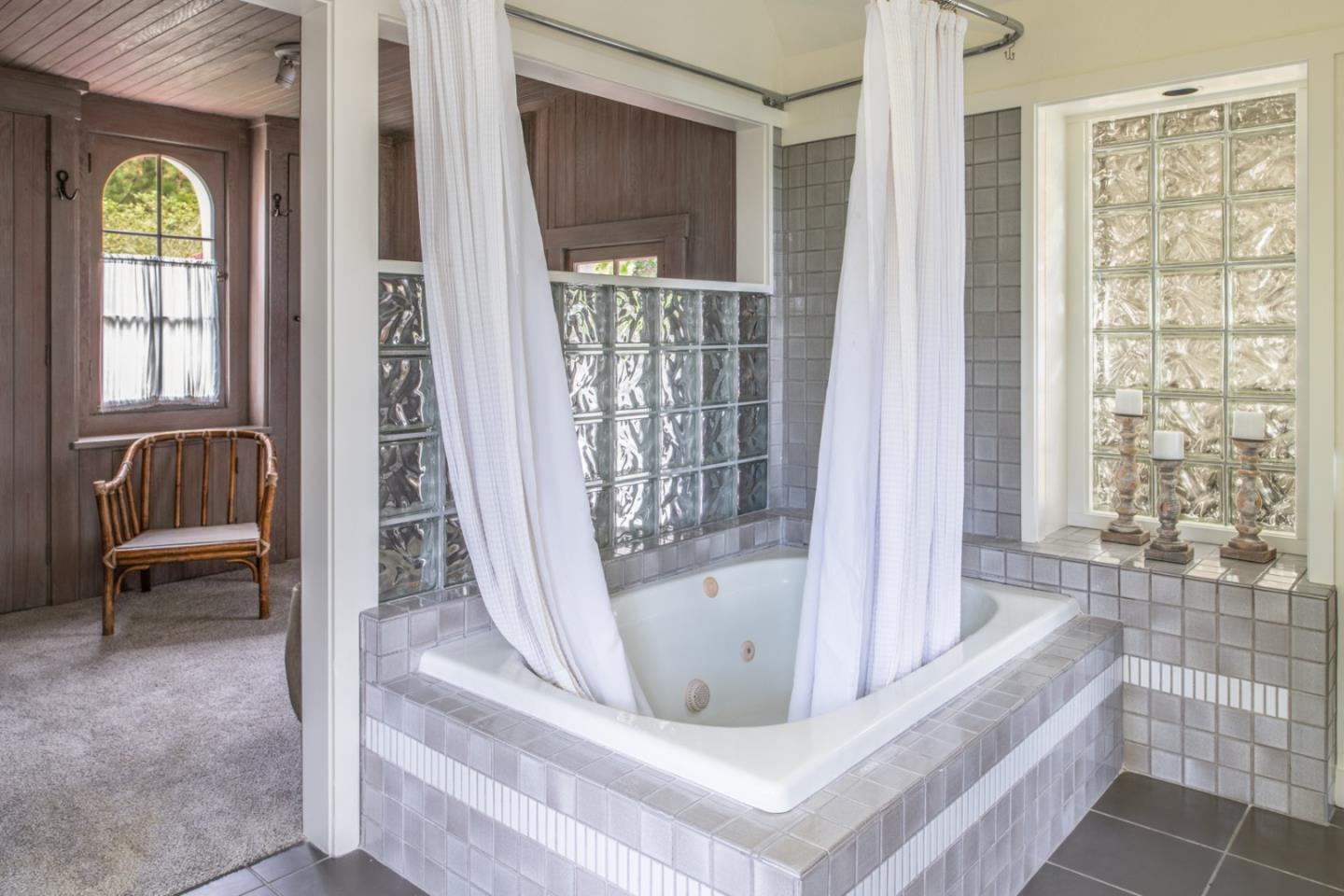 112 Pine Way Carmel Highlands, CA 93923 - Photo 26 of 33 a view of spacious bathroom with a tub and glass door