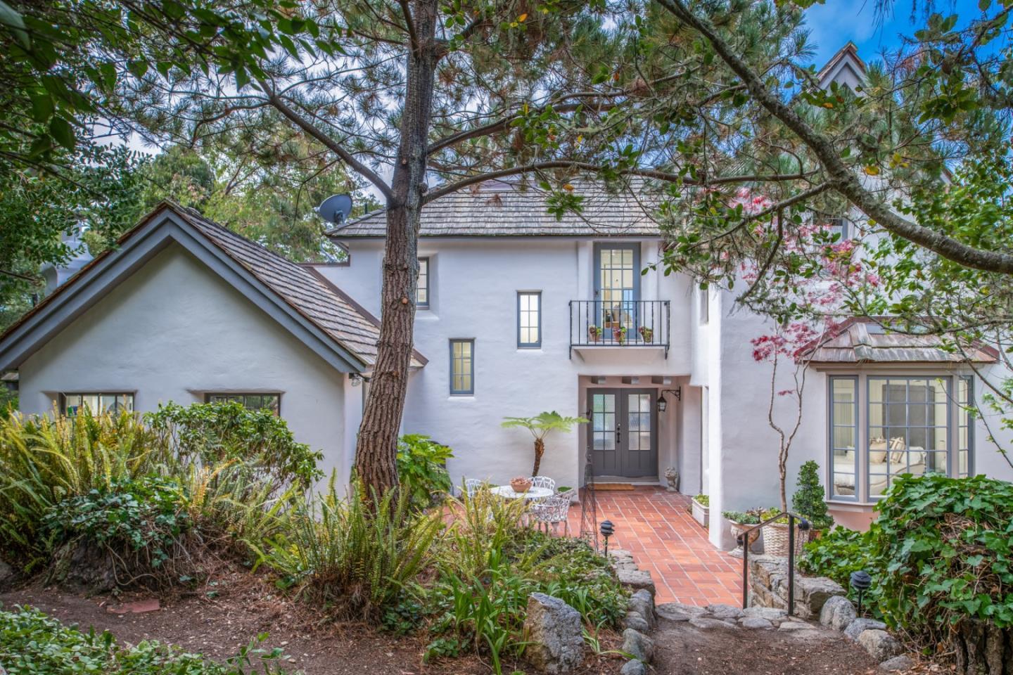 112 Pine Way Carmel Highlands, CA 93923 - Photo 3 of 33 a front view of a house with garden