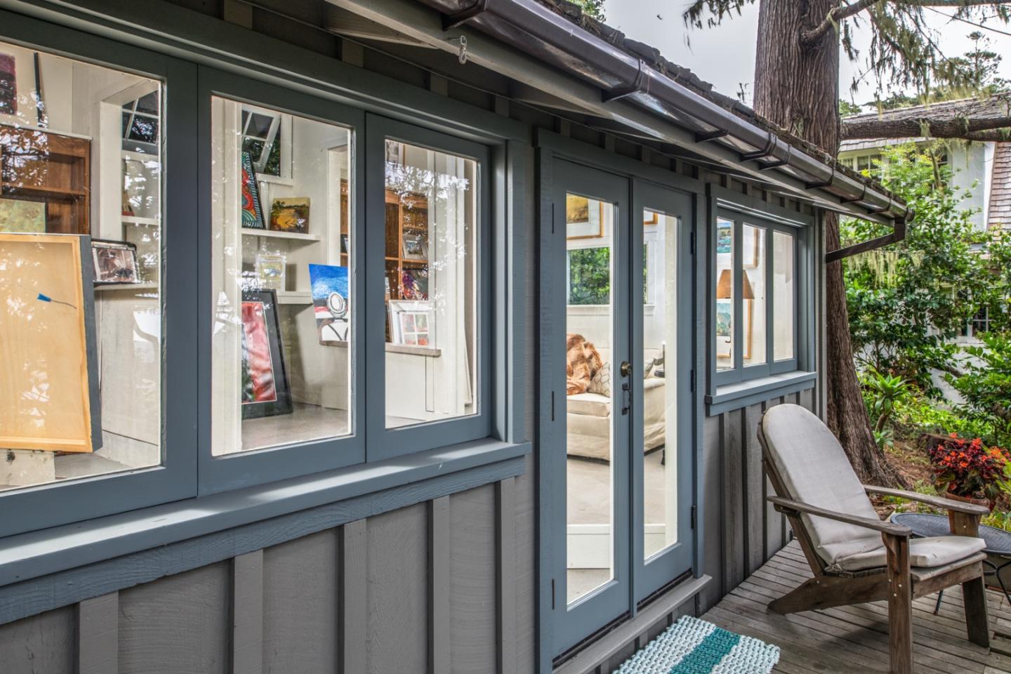 112 Pine Way Carmel Highlands, CA 93923 - Photo 32 of 33 a view of a porch with a furniture and floor to ceiling window