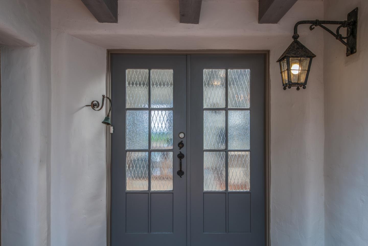 112 Pine Way Carmel Highlands, CA 93923 - Photo 5 of 33 a bathroom with a glass shower door and a window