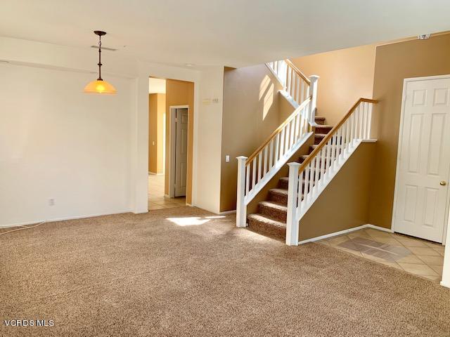 2153 Ribera Drive Oxnard, CA 93030 - Photo 12 of 34 a view of empty room with stairs and wooden floor