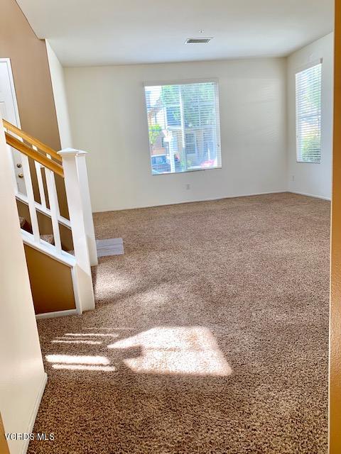 2153 Ribera Drive Oxnard, CA 93030 - Photo 13 of 34 a view of an empty room with wooden floor and a window