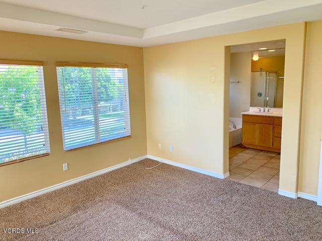2153 Ribera Drive Oxnard, CA 93030 - Photo 16 of 34 an empty room with windows and bathroom view
