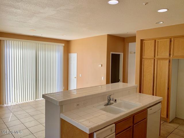 2153 Ribera Drive Oxnard, CA 93030 - Photo 25 of 34 a bathroom with a sink and a mirror