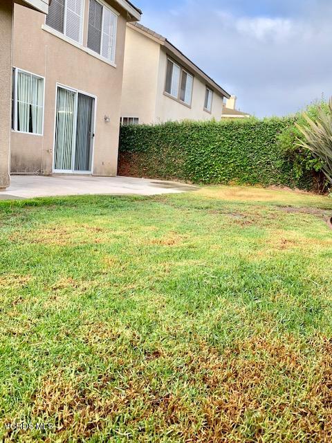2153 Ribera Drive Oxnard, CA 93030 - Photo 34 of 34 a view of yellow house with a yard