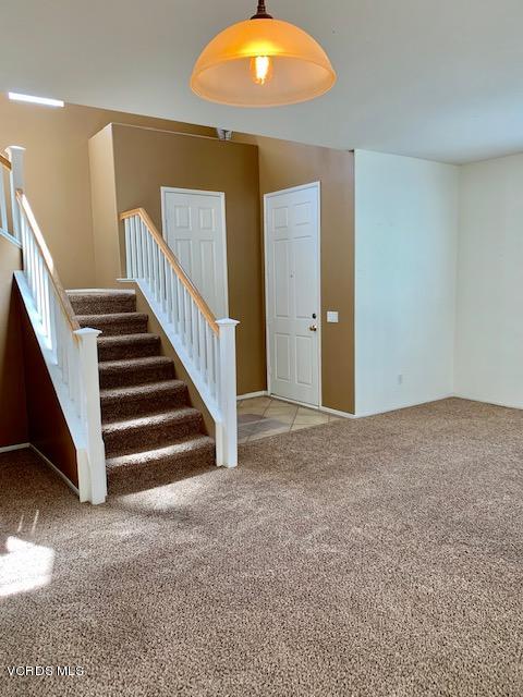 2153 Ribera Drive Oxnard, CA 93030 - Photo 10 of 34 a view of an empty room with wooden floor and stairs