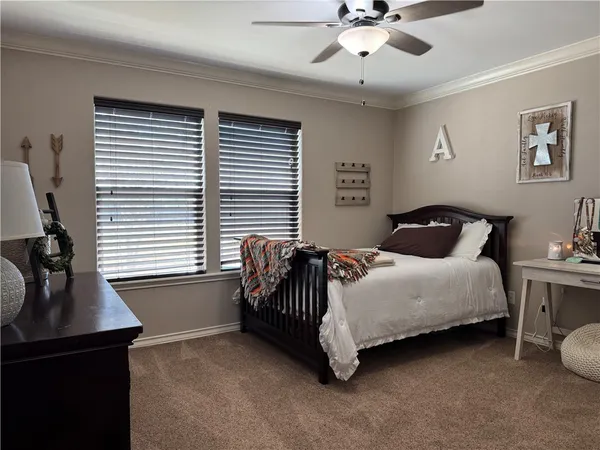 a bedroom with a bed and a table