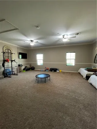 a living room with furniture and a lamp