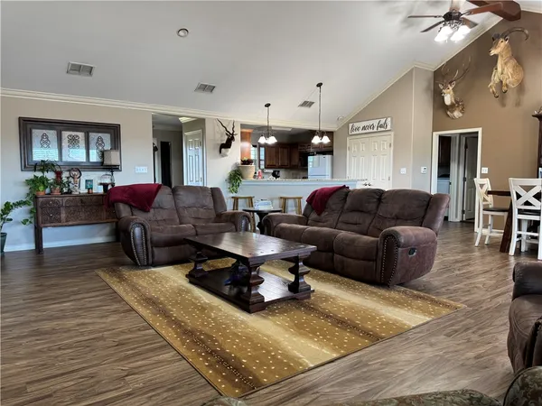 a living room with furniture or couch and a wooden floor