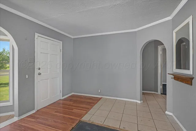 a view of room with window and hallway