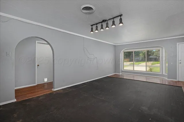 a view of an empty room with a window