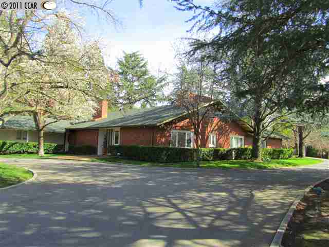 99 Post Road Alamo, CA 94507 - Photo 1 of 1 a front view of a house with a yard and trees