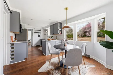 a view of a dining room with furniture window and wooden floor