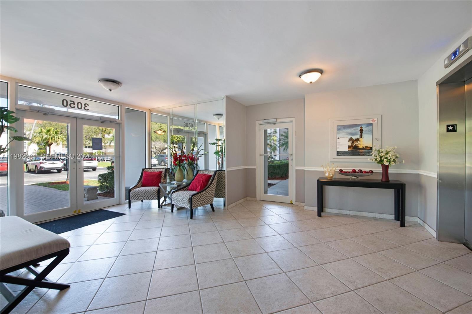 3050 Northeast 48th Court, Unit 401 Lighthouse Point, FL 33064 - Photo 25 of 35 a living room filled with furniture