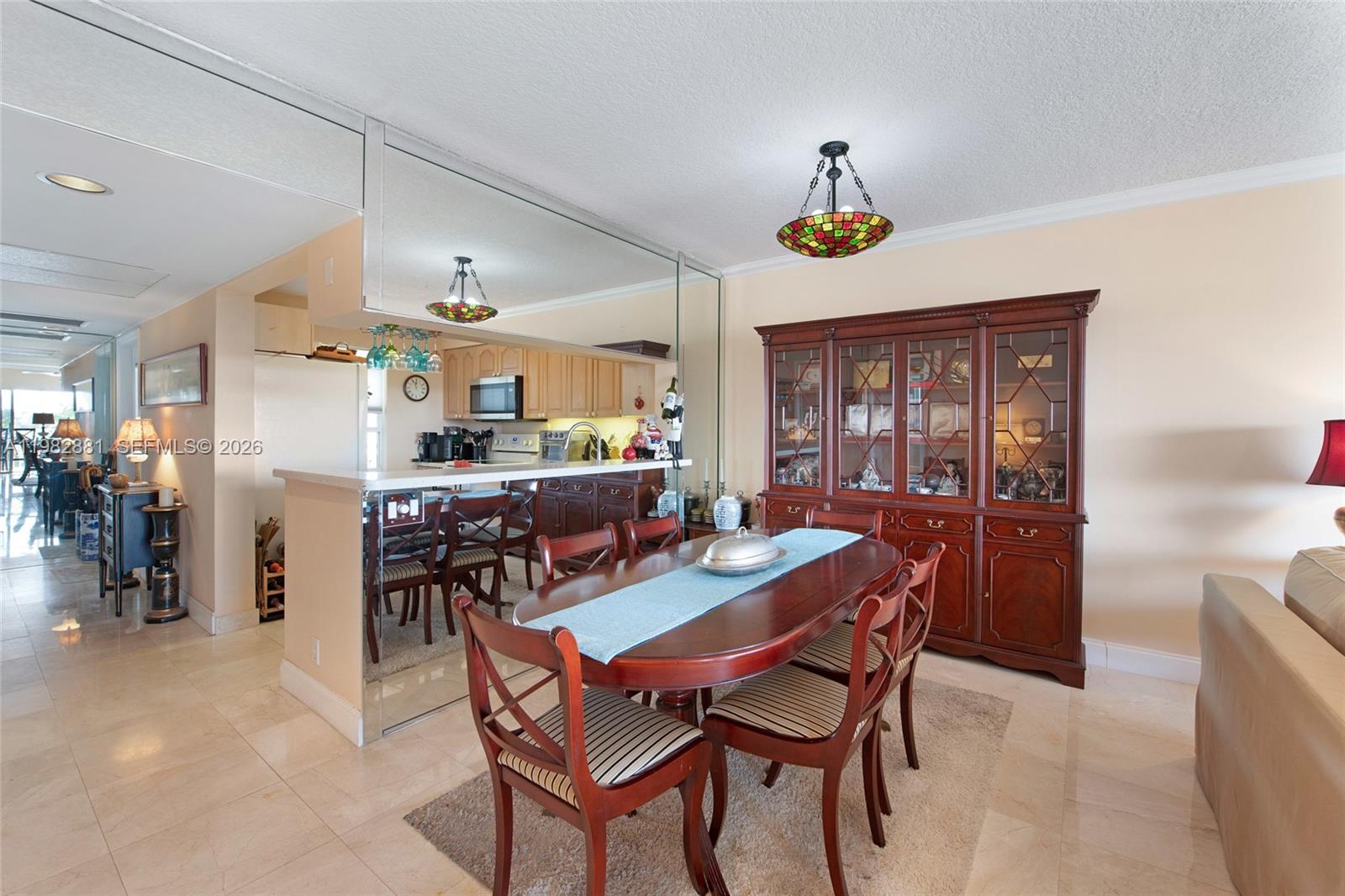 3050 Northeast 48th Court, Unit 401 Lighthouse Point, FL 33064 - Photo 6 of 35 a dining room with furniture and window