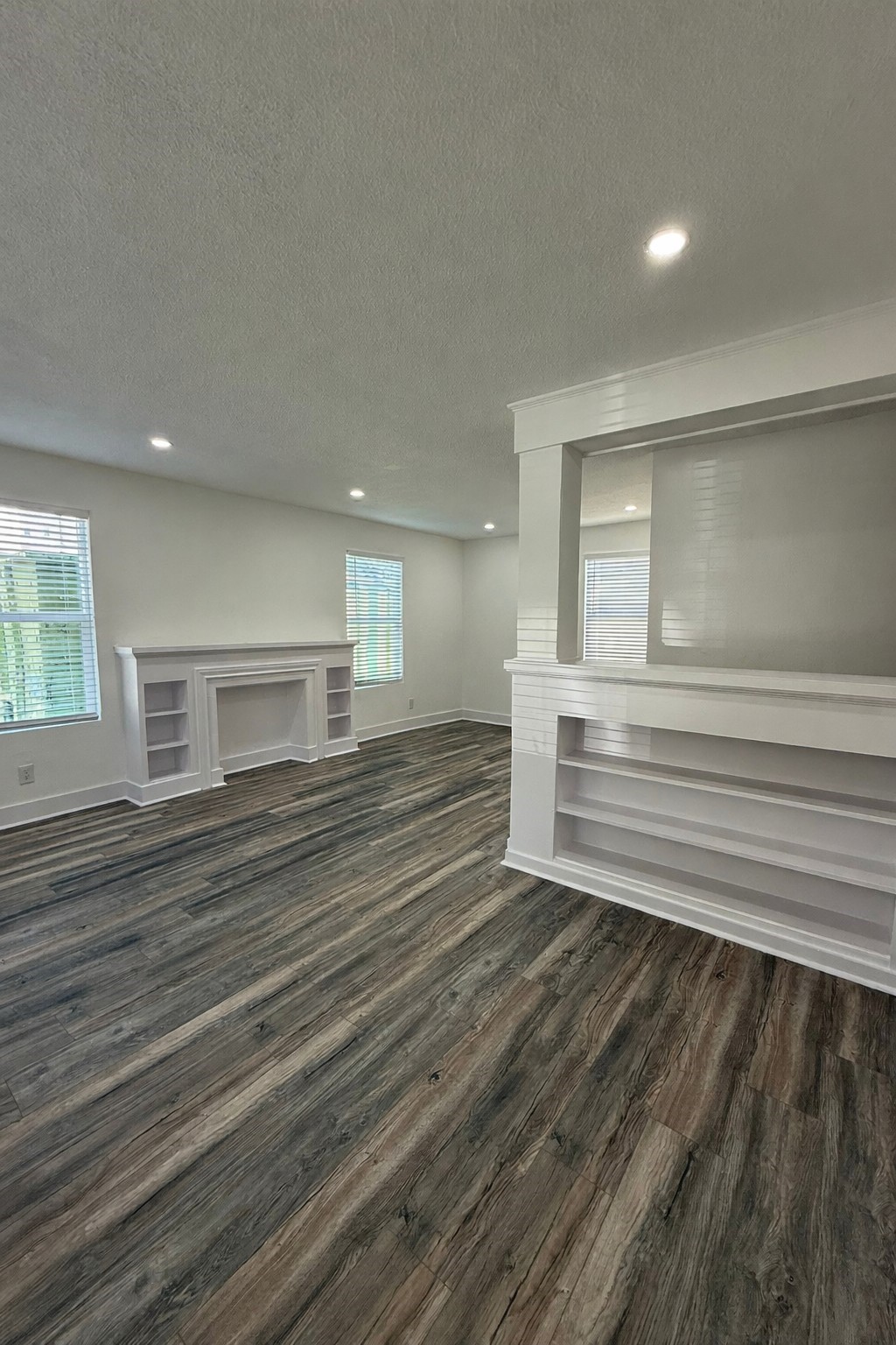 705 Stanford Street, Unit A Houston, TX 77019 - Photo 3 of 16 a view of empty room with wooden floor and fan