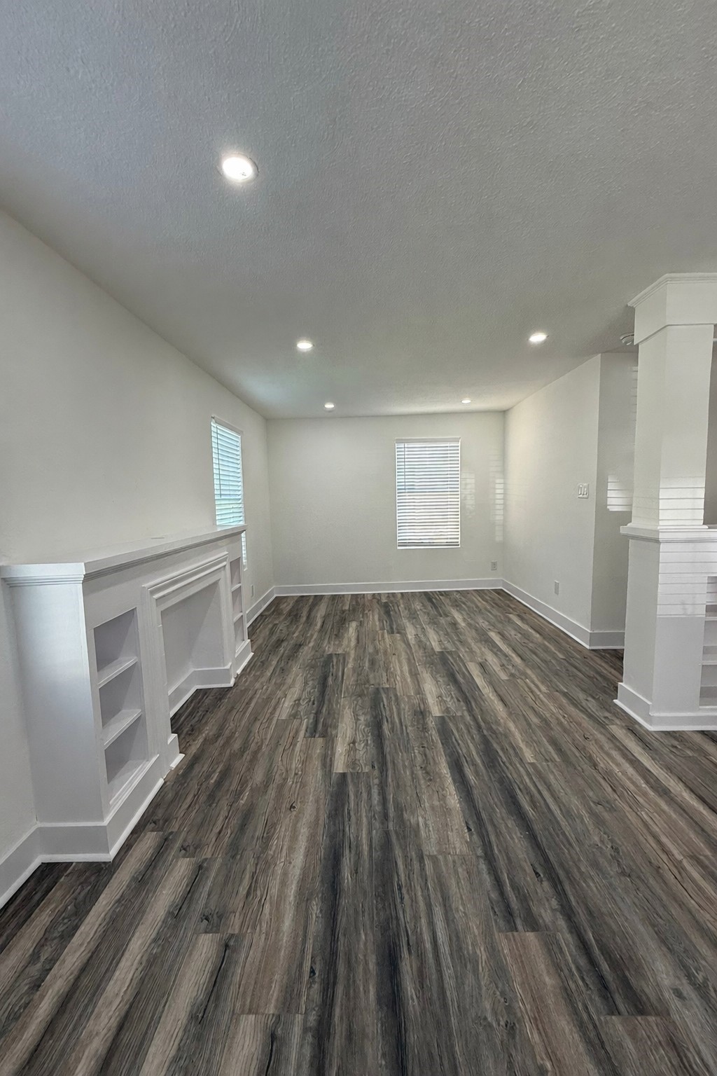 705 Stanford Street, Unit A Houston, TX 77019 - Photo 4 of 16 wooden floor in an empty room with a window
