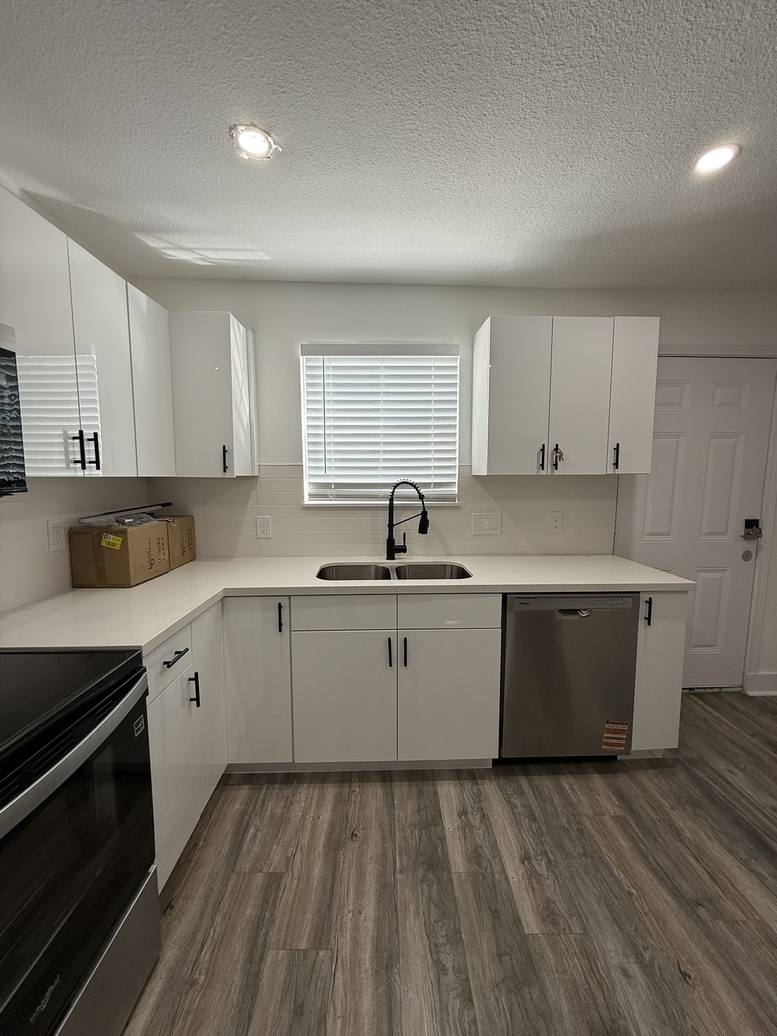 705 Stanford Street, Unit A Houston, TX 77019 - Photo 7 of 16 a kitchen with a sink and cabinets