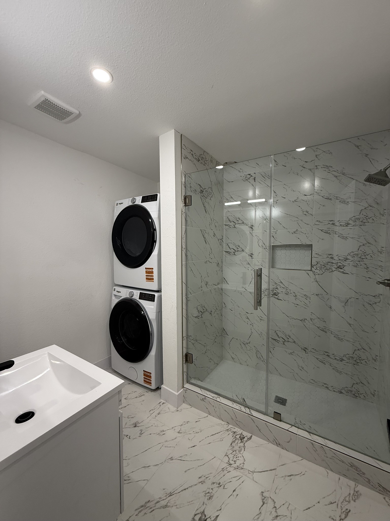 705 Stanford Street, Unit A Houston, TX 77019 - Photo 10 of 16 a bathroom with a sink a toilet and shower