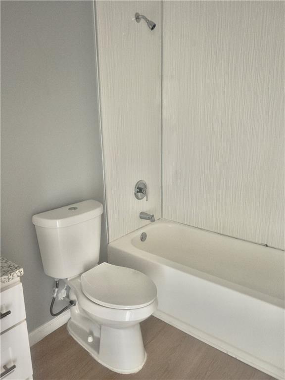 3669 Martin Luther King Junior Drive Southwest Atlanta, GA 30331 - Photo 24 of 24 a white toilet sitting next to a bath tub