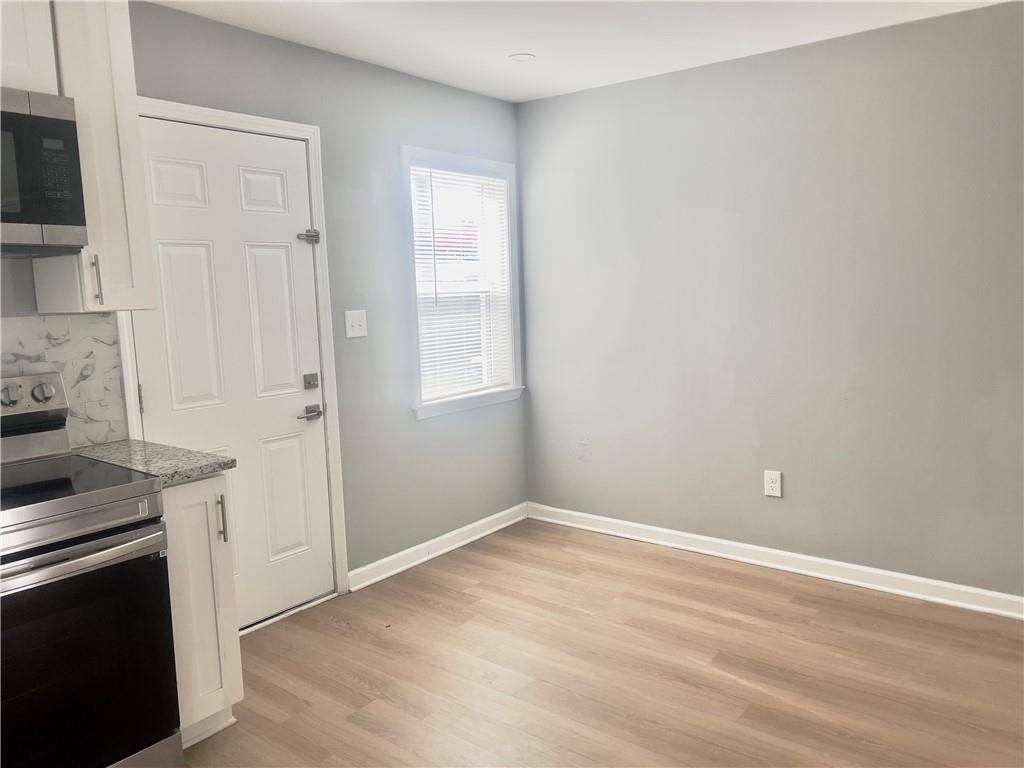 3669 Martin Luther King Junior Drive Southwest Atlanta, GA 30331 - Photo 10 of 24 a view of a kitchen with dishwasher stove and refrigerator
