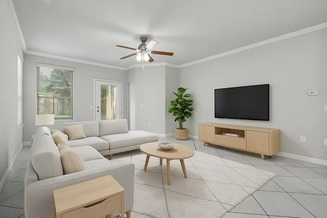 a living room with furniture and a flat screen tv