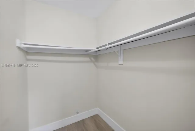 a view of a room with shelf on the wall