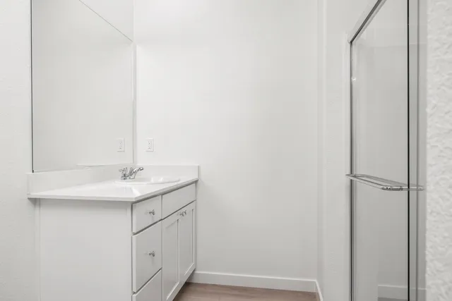 a bathroom with a sink and mirror