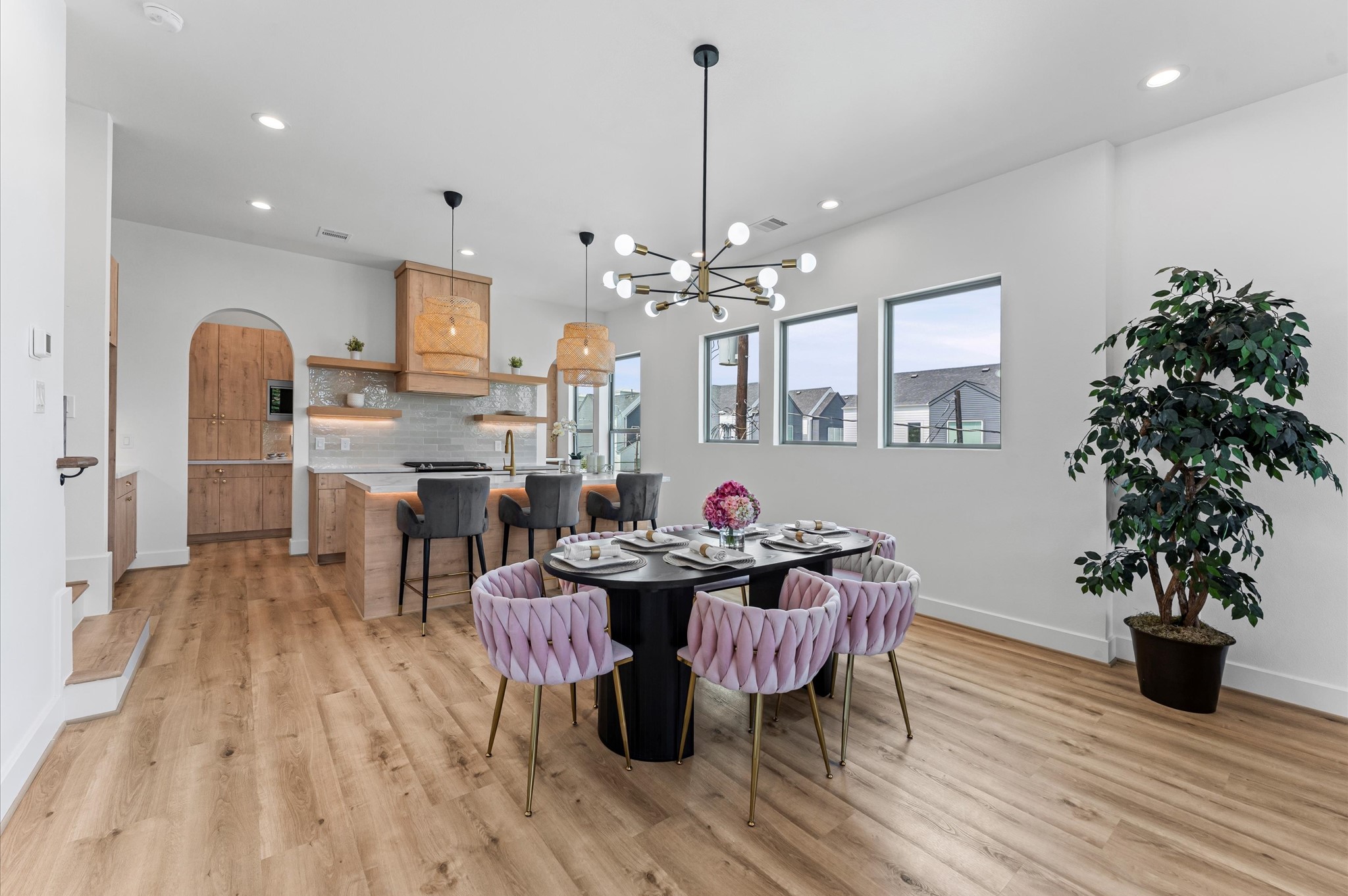 1122 West 17th Street, Unit D Houston, TX 77008 - Photo 12 of 37 a view of a dining room with furniture and wooden floor