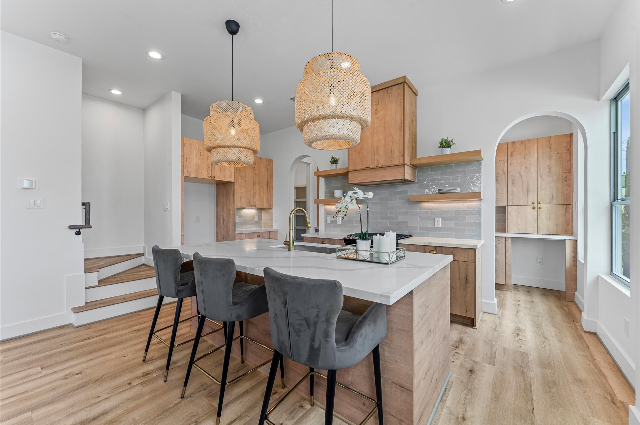 1122 West 17th Street, Unit D Houston, TX 77008 - Photo 14 of 37 a kitchen with a dining table chairs and wooden floor