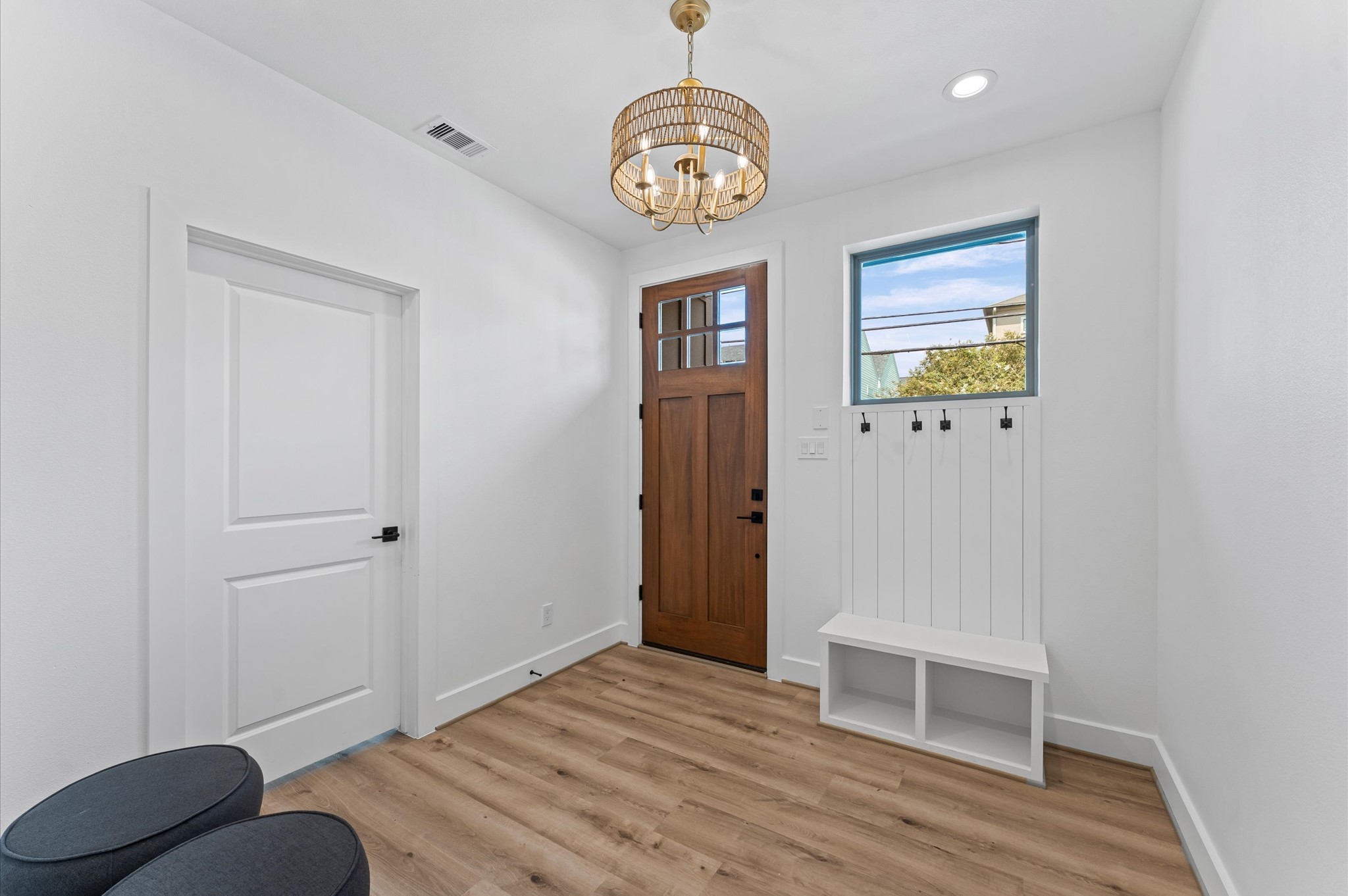 1122 West 17th Street, Unit D Houston, TX 77008 - Photo 4 of 37 a view of a hallway with wooden floor and front door