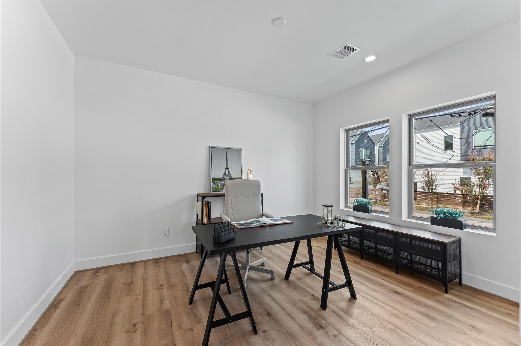 1122 West 17th Street, Unit D Houston, TX 77008 - Photo 5 of 37 a view of a workspace with furniture and a window