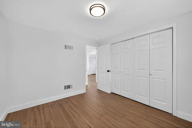 a view of room with wooden floor