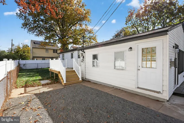 a view of backyard with a small cabin