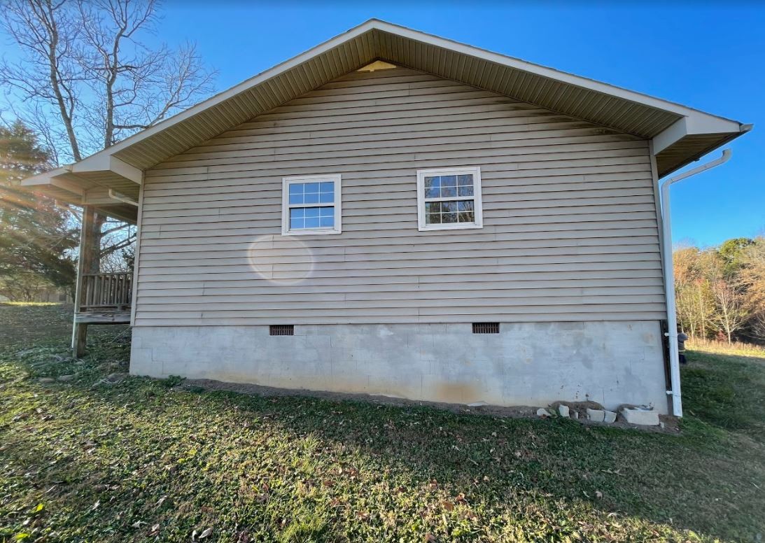 150 Scenic Drive Spring City, TN 37381 - Photo 2 of 13 a front view of a house with a yard