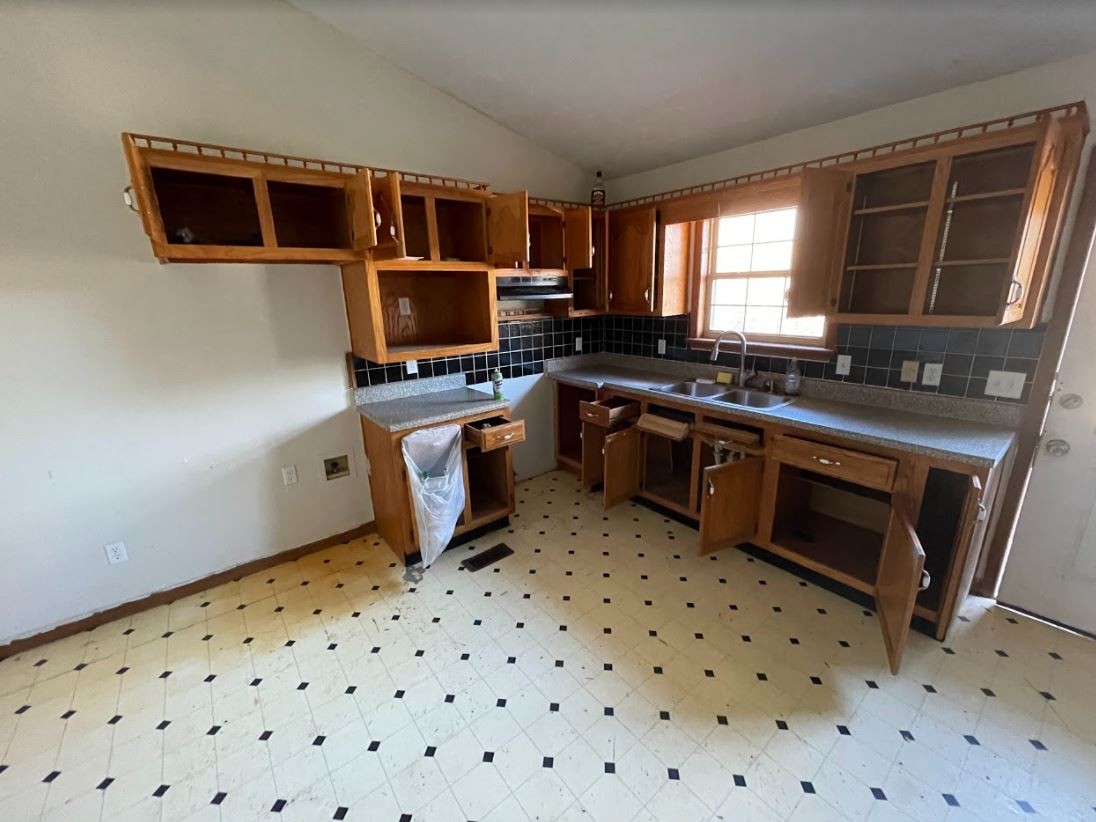 150 Scenic Drive Spring City, TN 37381 - Photo 4 of 13 a kitchen with a sink a stove and microwave