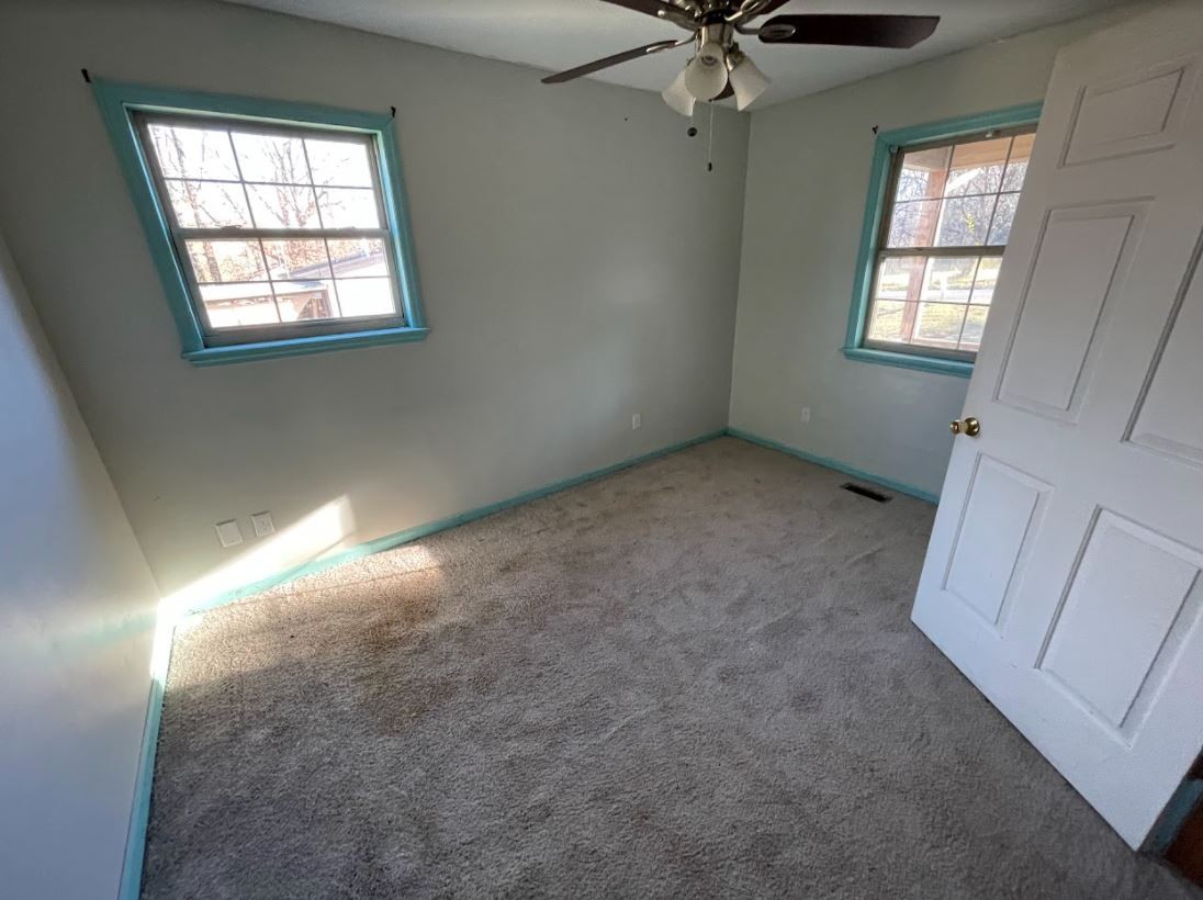 150 Scenic Drive Spring City, TN 37381 - Photo 9 of 13 an empty room with windows and fan