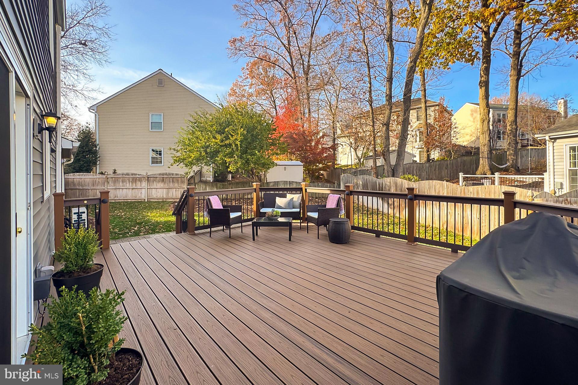 12584 Rock Ridge Road Herndon, VA 20170 - Photo 8 of 28 Composite Deck Overlooks Yard w/ Irrigation+ Fence