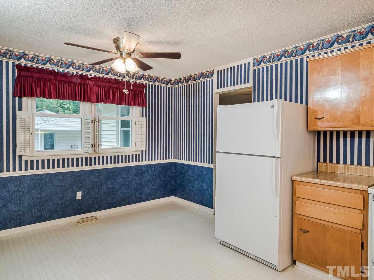 3308 Apache Drive Raleigh, NC 27609 - Photo 14 of 29 a kitchen with refrigerator and window