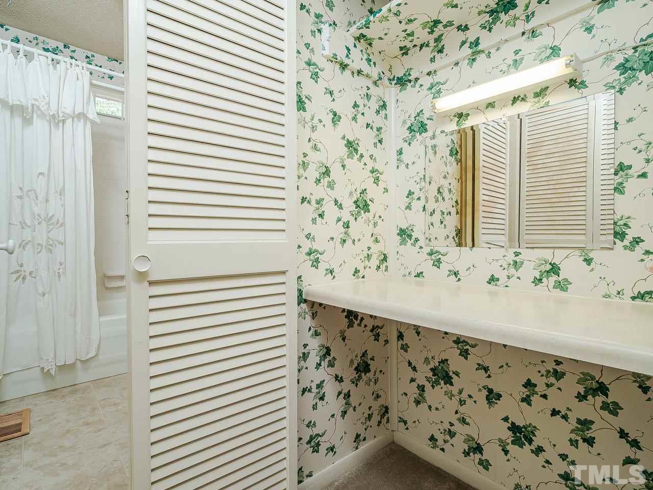 3308 Apache Drive Raleigh, NC 27609 - Photo 16 of 29 a bathroom with a bathtub and shower