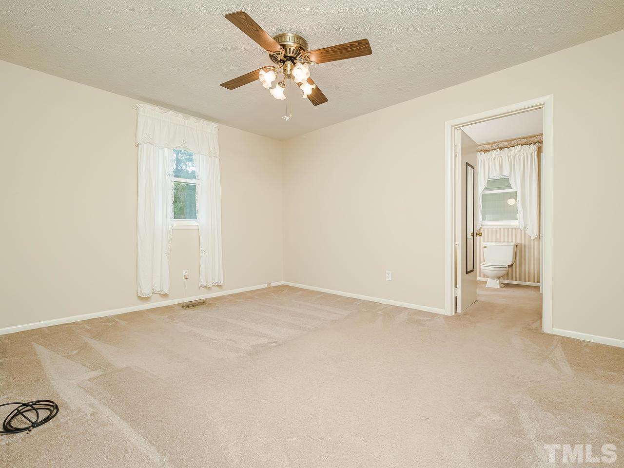 3308 Apache Drive Raleigh, NC 27609 - Photo 18 of 29 an empty room with a bathroom