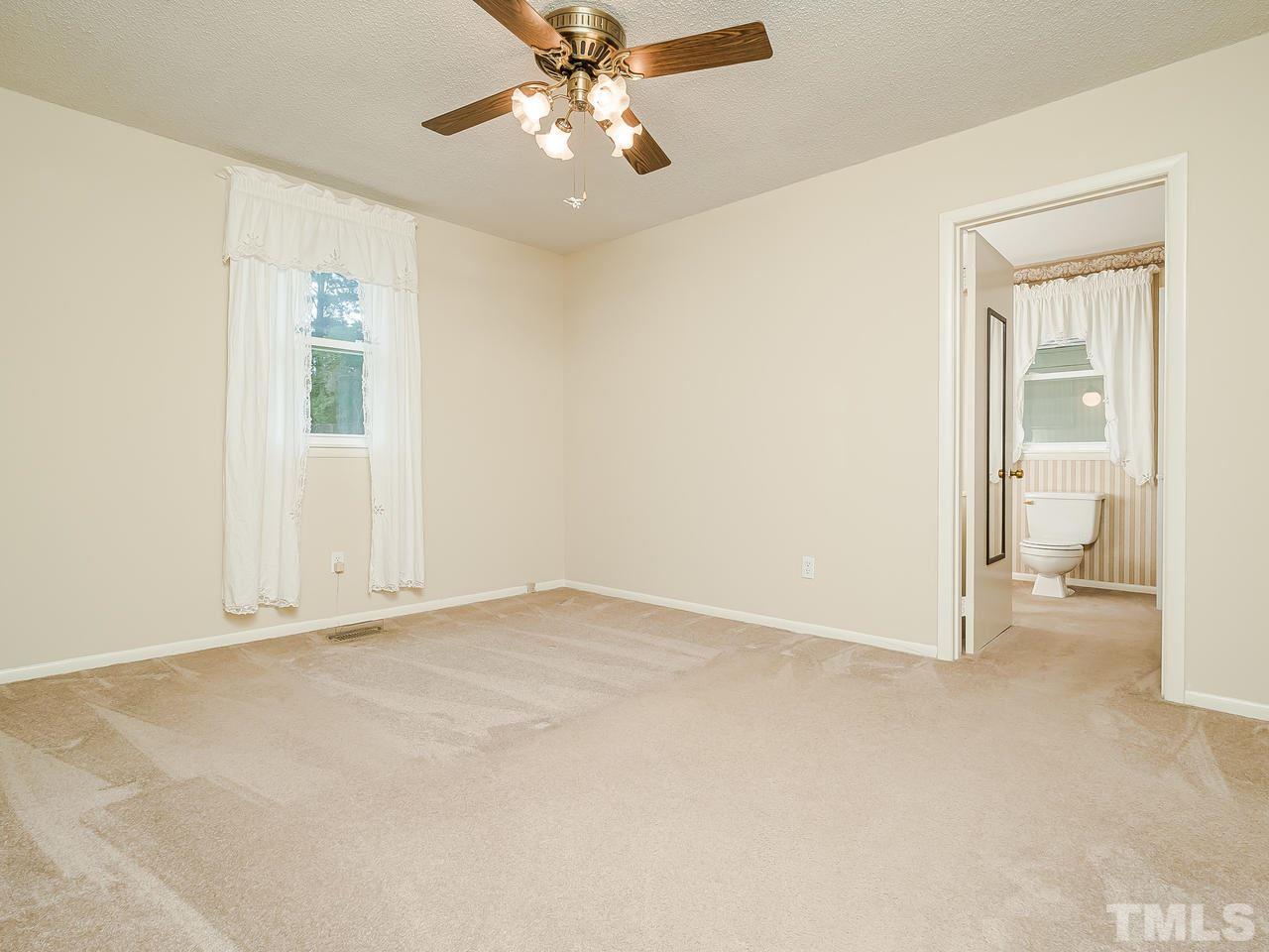 3308 Apache Drive Raleigh, NC 27609 - Photo 19 of 29 an empty room with windows and fan