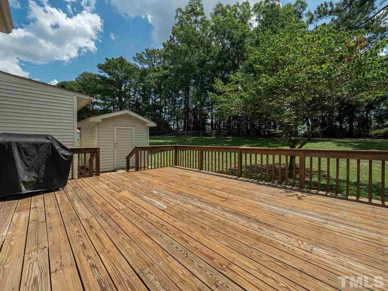 3308 Apache Drive Raleigh, NC 27609 - Photo 26 of 29 a view of wooden deck and a garden