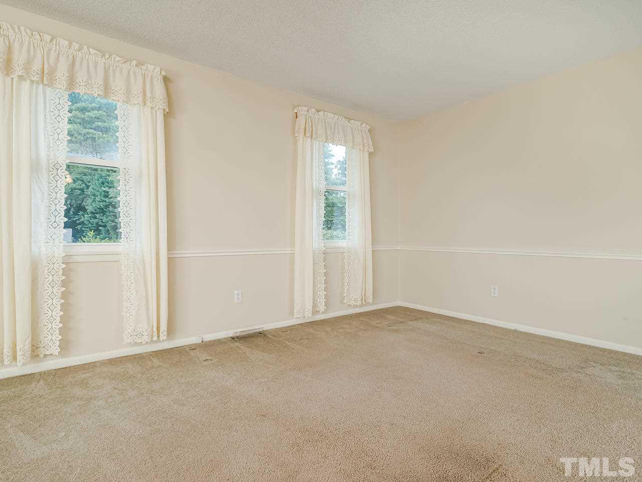 3308 Apache Drive Raleigh, NC 27609 - Photo 7 of 29 an empty room with windows